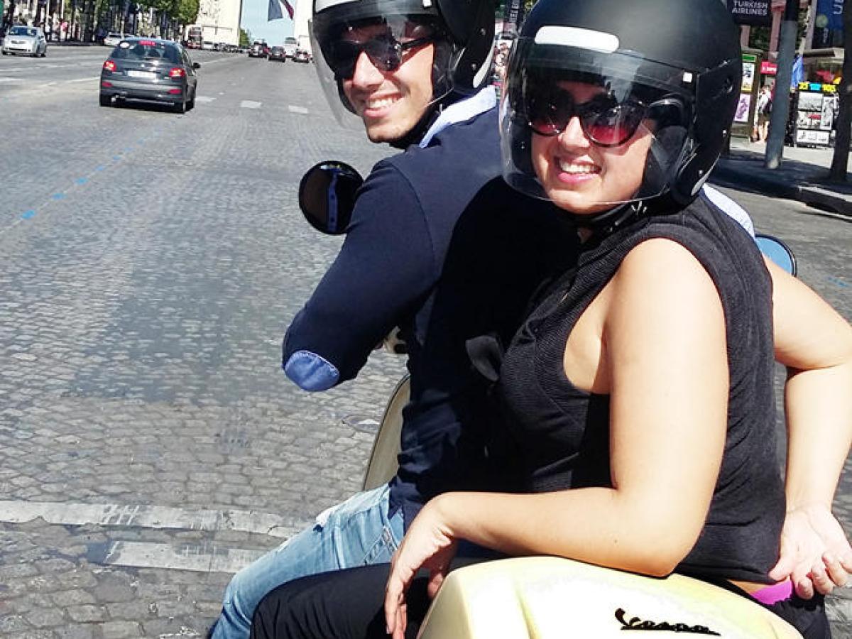 Man and woman on Vespa