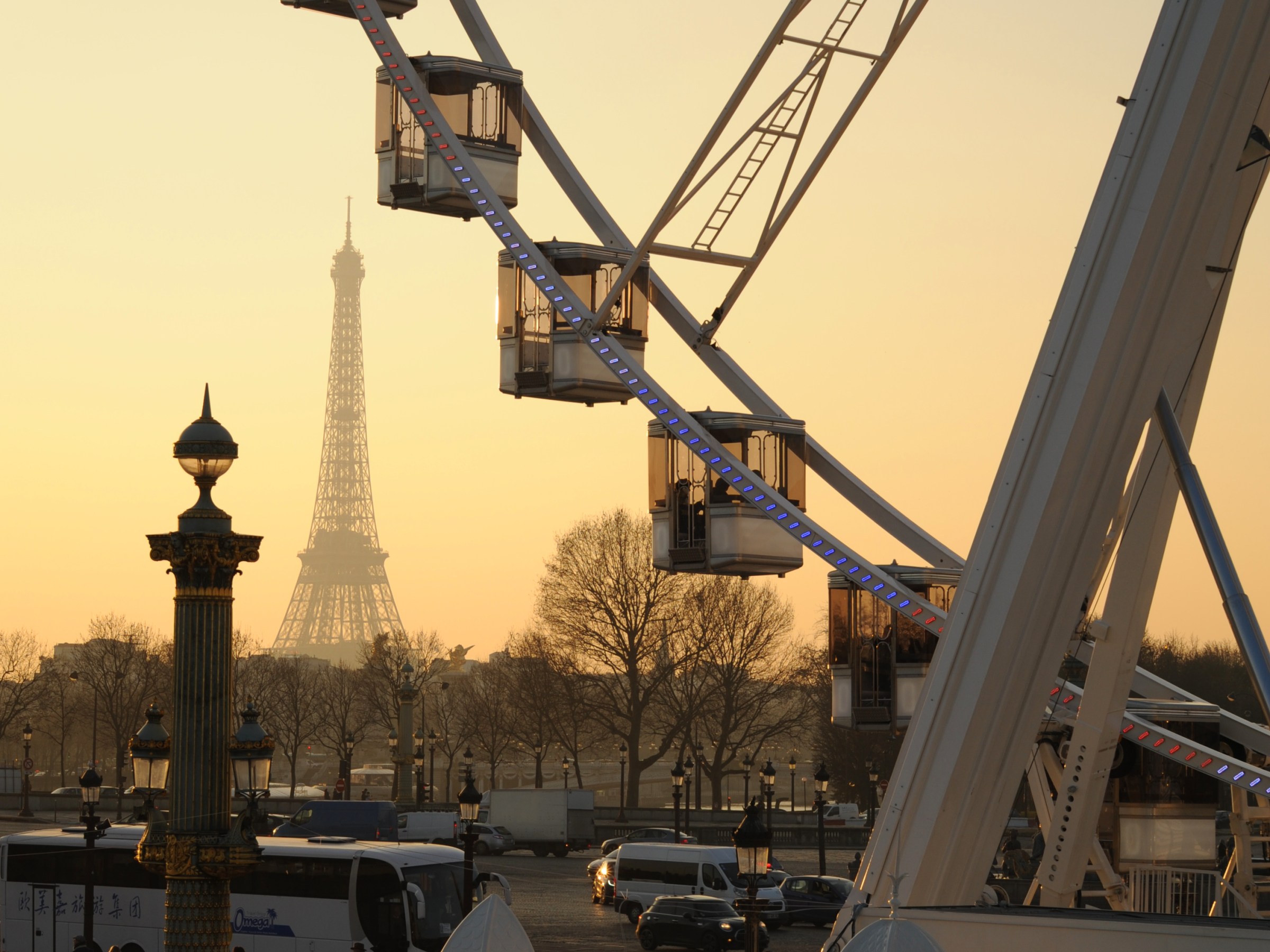 Ferris wheel with Eiffel Tower behind