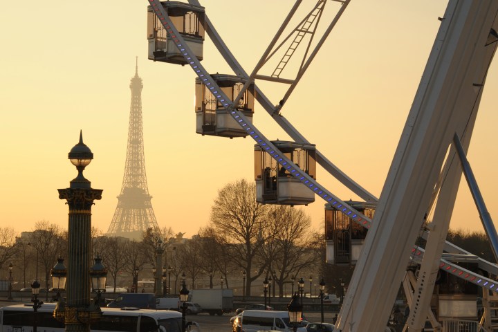 Ferris wheel with Eiffel Tower behind