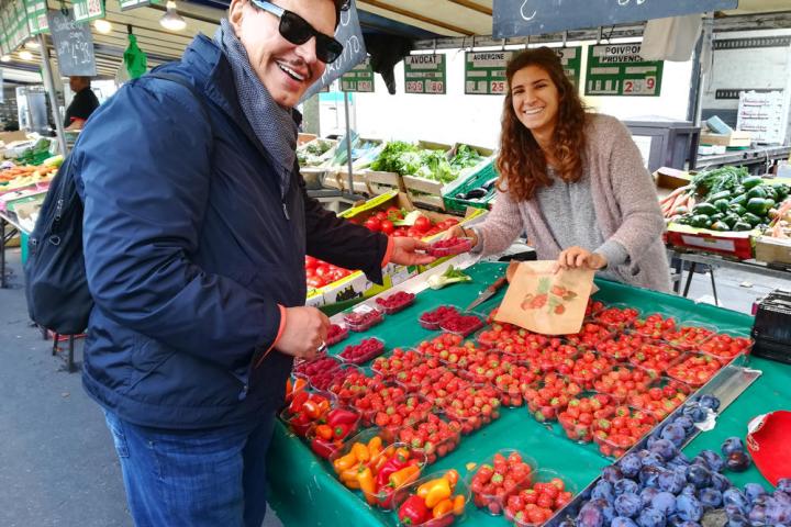 Man purchasing strawberries