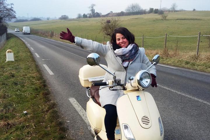 Woman on a Vespa in the countryside