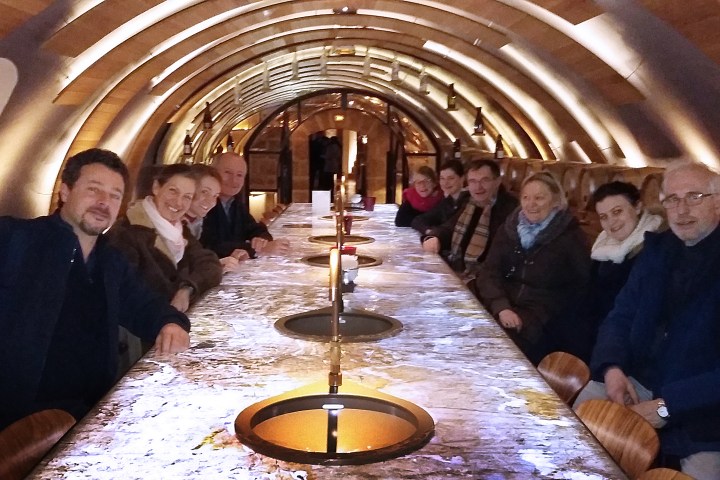Group sitting around table on tour